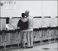  ?? AP/ DAVID GOLDMAN ?? A voter casts a ballot Tuesday in Atlanta in a special election to fi ll the U. S. House seat vacated by Tom Price, who resigned to serve as U. S. health secretary.