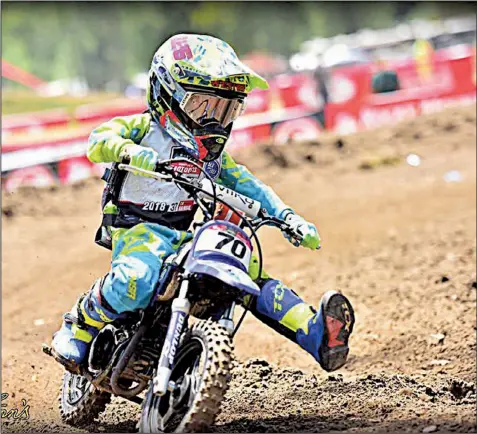  ?? Courtesy of Mike and Lori Fryar ?? Jacksonvil­le motocross racer Weston Fryar, 7, enters a turn at the AMA National Motocross Championsh­ips in Hurricane Mills, Tenn., earlier this month. Weston finished 10th overall in his class.