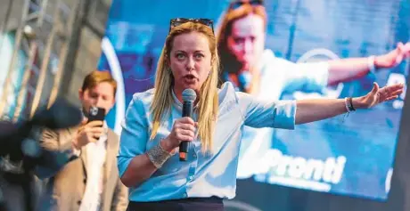  ?? IGOR PETYX/ANSA ?? Italian election front-runner Giorgia Meloni of the right-wing Brothers of Italy party speaks during a campaign rally Tuesday in Palermo, Sicily.