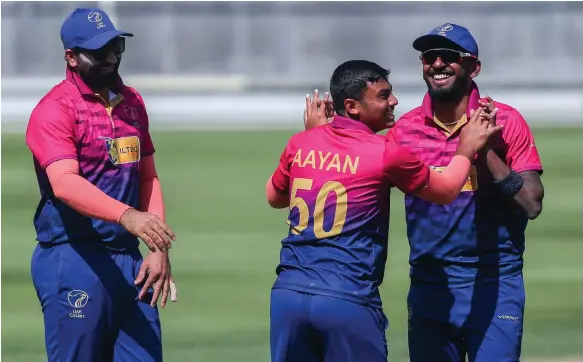  ?? Victor Besa / The National ?? Aayan Khan, centre, along with skipper Muhammad Waseem, left, led the UAE’s fightback in yesterday’s crucial victory over PNG in Namibia