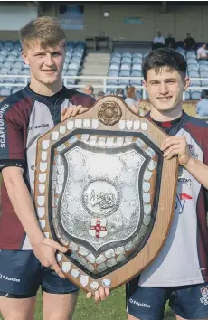  ??  ?? Euan Govier and Jonty Holloway show off the silverware