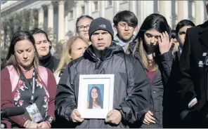  ?? PICTURE: J SCOTT APPLEWHITE/AP (ANA) ?? Ilan Alhadeff and his wife Lori, left, with a photo of their daughter,alyssa, 14, who was killed in last month’s shooting at Marjory Stoneman Douglas High School in Florida, at a rally in support of gun control.