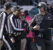  ?? CHRIS SZAGOLA — ASSOCIATED PRESS ?? Eagles head coach Doug Pederson talks with the officials during game against the Vikings.