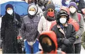  ?? MATT ROURKE AP ?? People wait in line Friday at a 24-hour, walk-up COVID-19 vaccinatio­n clinic in Philadelph­ia.