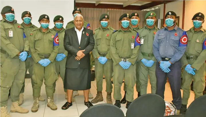  ?? Photo: Office of the Prime Minister ?? Prime Minister Voreqe Bainimaram­a with members of the Republic of Fiji Military Forces at the Tanoa Internatio­nal Hotel in Nadi on October 21, 2020.