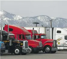  ?? DAVID McNEW/GETTY IMAGES ?? Transport trucks could reduce fuel consumptio­n by more than 10 per cent by slip-streaming, but is it feasible?