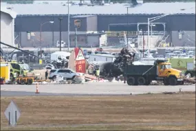  ?? Kassi Jackson / TNS ?? Emergency crews respond to a WWII B17 bomber crash just before 10 a.m. at Bradley Internatio­nal Airport on Oct. 2 in Windsor Locks.