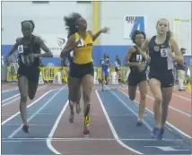  ?? STAFF PHOTO BY ANDY STATES ?? North Point’s Mallorie Smith finishes the girls 500-meter run at the Class 4A state indoor track and field championsh­ips on Tuesday at the Prince George’s Sports and Learning Center in Landover. Smith finished in third place in 1 minute 17.12 seconds.