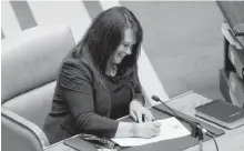  ?? KEITH GOSSE • THE TELEGRAM ?? Pam Parsons is sworn in as the MHA for the district of Harbour Grace-port de Grave during a ceremony at the House of Assembly Monday morning.