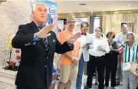  ?? CARLINE JEAN/SOUTH FLORIDA SUN SENTINEL ?? Roger Stone speaks to supporters Monday during a Republican group’s Oktoberfes­t party at Josef & Joseph - Jewelry Watch Clock Store in Fort Lauderdale. Stone goes on trial next week.