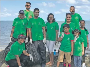  ?? Photo: Ashna Kumar ?? Coca-Cola Amatil Fiji staff members with their family members cleaning up the Suva foreshore on June 16, 2018.