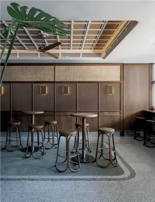  ??  ?? Above — The three interconne­cted spaces (front bar and two dining spaces behind) use the same materials palette to convey a single statement about the history of the pub.