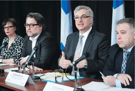  ?? PAUL CHIASSON/THE CANADIAN PRESS ?? Quebec ministers, left to right, Lucie Charlebois, David Heurtel, Jean-Marc Fournier and Sebastien Proulx discuss the recent increase in asylum seekers crossing into Quebec during a news conference in Montreal on Monday.