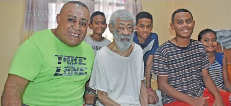  ?? Photo: Waisea Nasokia. ?? Olympian Sitiveni Moceidreke (second from left) with his son, Peni and his grandchild­ren at their home in Lautoka.