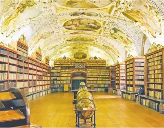 ??  ?? Books from the 10th to 17th centuries are housed at the library at Strahov Monastery in Prague.