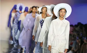  ??  ?? Models present creations from the Fengyi Tan Spring/Summer 2020 collection during the New York Fashion Week in New York, the United States, on September 4, 2019.