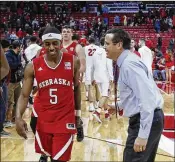  ?? ANDY MANIS / ASSOCIATED PRESS ?? Nebraska coach Tim Miles encourages Glynn Watson (5) and other players after a recent win. The Cornhusker­s are 0-7 against “Quadrant 1” foes.