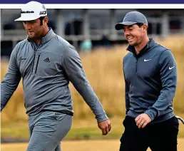  ??  ?? Relaxed: Rory McIlroy (right) and Jon Rahm in practice GETTY