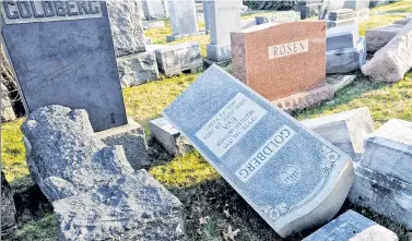  ??  ?? GRAVE THREAT: It’s time to crack down on hate crimes, such as the vandalizat­ion of this Jewish cemetery in Philadelph­ia and hundreds of bomb threats to Jewish centers since January.