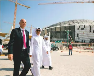  ??  ?? Work in progress...FIFA president Gianni Infantino (left) inspects the Al Wakrah Stadium in Qatar