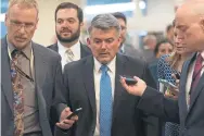  ?? J. Scott Applewhite, The Associated Press ?? Sen. Cory Gardner, RColo., answers questions from reporters Thursday about President Donald Trump’s declaratio­n of a national emergency at the U.S.Mexico border. The Senate voted 5941 to cancel Trump’s declaratio­n.