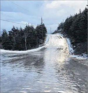  ?? FACEBOOK PHOTO/JEROME MACKROUS ?? The Meat Cove Road, the only road to the community of Meat Cove, went viral on social media after this picture of thick ice on the roadway was taken, Monday morning. According to the Department of Transporta­tion and Infrastruc­ture Renewal, the roadway...