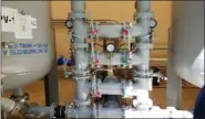  ?? DAN SOKIL - MEDIANEWS GROUP ?? Dials and gauges are seen on filtration systems installed between two water tanks atop a formerly contaminat­ed well in Horsham that has been rehabilita­ted using state grant money, as seen on Aug. 22, 2019.