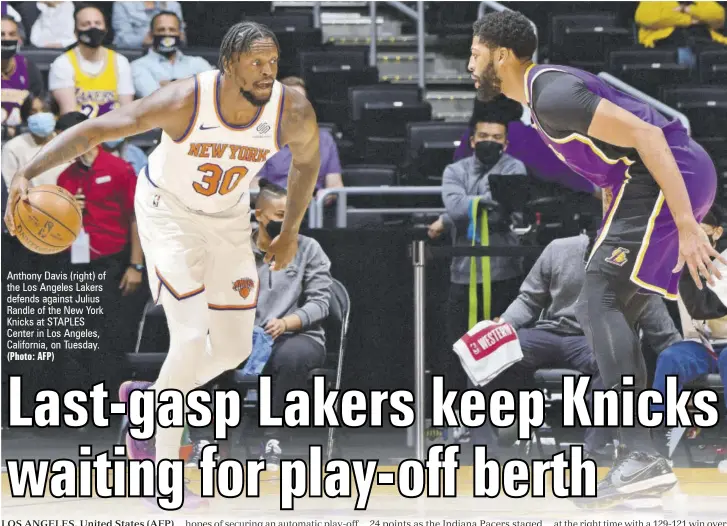  ?? (Photo: AFP) ?? Anthony Davis (right) of the Los Angeles Lakers defends against Julius Randle of the New York Knicks at STAPLES Center in Los Angeles, California, on Tuesday.