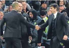  ??  ?? Pep Guardiola and Antonio Conte shake hands.