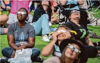  ?? Carlos Javier Sanchez/Contributo­rs ?? Eclipse viewers gather Oct. 14 for La Fiesta del Sol: Celebratio­n of the Sun Annular Eclipse Event at San Antonio College. Plenty of places are hosting events for the total solar eclipse April 8.