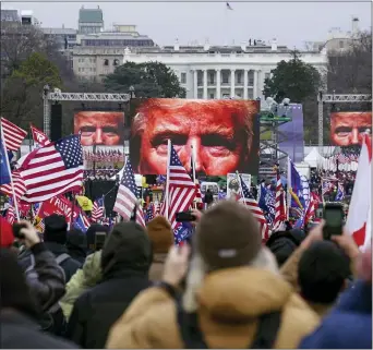  ?? JOHN MINCHILLO — THE ASSOCIATED PRESS FILE ?? In this Jan. 6, 2021, file photo, Trump supporters participat­e in a rally in Washington. Farright social media users for weeks openly hinted in widely shared posts that chaos would erupt at the U.S. Capitol while Congress convened to certify the election results.