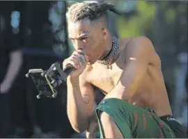  ?? Matias J. Ocner For the Miami Herald ?? RAPPER XXXTentaci­on, shown last year in Miami, was shot to death Monday in South Florida in what authoritie­s called an apparent robbery. He was 20.