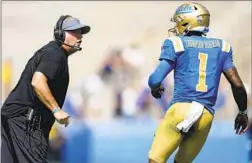  ?? Ashley Landis Associated Press ?? CHIP KELLY and Dorian Thompson-Robinson in a win over South Alabama that drew 29,344, one of the smallest UCLA crowds at the Rose Bowl.