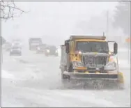  ?? PETE BANNAN – DIGITAL FIRST MEDIA ?? A PennDOT snowplow clears West Chester Pike in West Goshen Thursday morning.