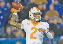  ?? THE ASSOCIATED PRESS ?? Tennessee quarterbac­k Jarrett Guarantano looks for a receiver during last week’s 29-26 loss at Kentucky, which dropped the Vols to 3-5 overall and 0-5 in SEC competitio­n this season.