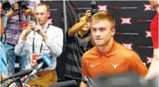  ?? AP PHOTO/DAVID KENT ?? Texas quarterbac­k Sam Ehlinger listens to a question during Big 12 Media Days on Tuesday at AT&T Stadium in Arlington, Texas.