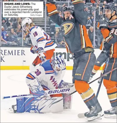  ?? Getty Images ?? HIGHS AND LOWS: The Ducks’ Jakob Silfverber­g celebrates his power-play goal over a dejected Henrik Lundqvist on Saturday.