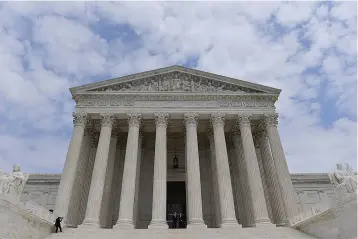  ?? Washington Post photo by Ricky Carioti ?? Justices Neil Gorsuch and John Roberts are pictured at the top steps of the Supreme Court in June 2017.