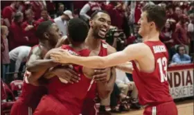  ?? AJ MAST — THE ASSOCIATED PRESS ?? Ohio State forward Keita Bates-Diop, center rear, celebrates with teammates Andrew Dakich, right, C.J. Jackson, center front, and Kam Williams after defeating Indiana in double overtime in Bloomingto­n, Ind. on Feb. 23.