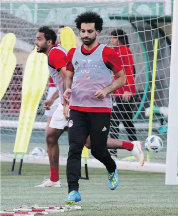  ?? KARIM JAAFAR/GETTY IMAGES ?? Mohamed Salah “prostrates every time he scores and everyone knows he is a Muslim.” Ten per cent of Egypt is Christian, but there are none on the national team.