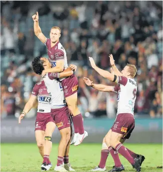  ?? Photo / Getty Images ?? Daly Cherry-Evans celebrates kicking Manly to their first victory of 2021 with his late field goal.