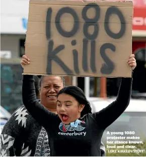  ?? LUKE KIRKEBY/STUFF ?? A young 1080 protester makes her stance known, loud and clear.