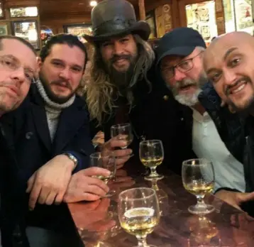 ??  ?? GAME NEARLY OVER: Kit Harington, Jason Momoa and Liam Cunningham take a break from filming season eight and meet fans in a pub in Belfast, where parts of the series are shot