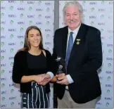  ??  ?? Leinster Post Primary player of the year Roisin Ennis receives the Bill Daly PPS award from Dominic Leech at the Leinster Convention in Newtown.