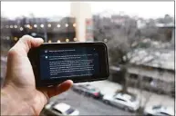  ?? Associated Press ?? A ChatGPT prompt is shown on a device near a public school in Brooklyn, N.Y., on Thursday. New York City school officials started blocking this week the impressive but controvers­ial writing tool that can generate paragraphs of human-like text.