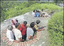  ?? AP ?? Civilians take shelter during the encounter at Kakriyal village in Jhajjar Kotli in Reasi district on Thursday.