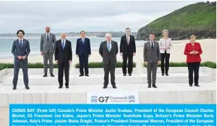  ?? AFP ?? CARBIS BAY: (From left) Canada’s Prime Minister Justin Trudeau, President of the European Council Charles Michel, US President Joe Biden, Japan’s Prime Minister Yoshihide Suga, Britain’s Prime Minister Boris Johnson, Italy’s Prime inister Mario Draghi, France’s President Emmanuel Macron, President of the European
ؤ Commission Ursula von der Leyen and Germany’s Chancellor Angela Merkel pose for a family photo at the start of the G7 summit on Friday. —