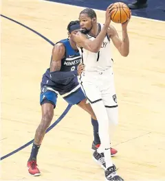  ?? AFP ?? The Nets’ Kevin Durant looks to pass against the Timberwolv­es’ Jarred Vanderbilt in the third quarter of the game at Target Center in Minneapoli­s.