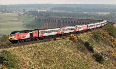  ?? JACK BOSKETT. ?? Virgin Trains East Coast 43308 crosses Culloden Viaduct on February 5 with the early morning Inverness-London Kings Cross Virgin Trains East Coast service. It is hoped that HSTs will fill the gap before the route to the Highland city is electrifie­d.