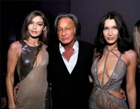  ??  ?? Above: Gigi with her father Mohamed and sister Bella after a Victoria’s Secret show in Paris